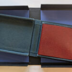 2 open blue clamshell boxes