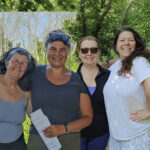 4 women posing proudly
